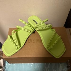 Trimmed in edgy pyramid studs, this strappy slide gives your favorite look